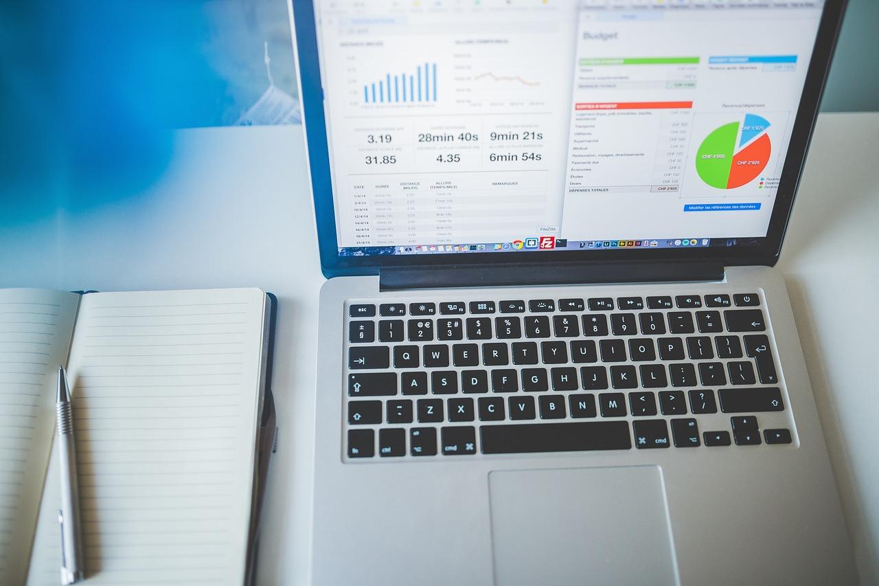 Laptop showing business charts and performance data